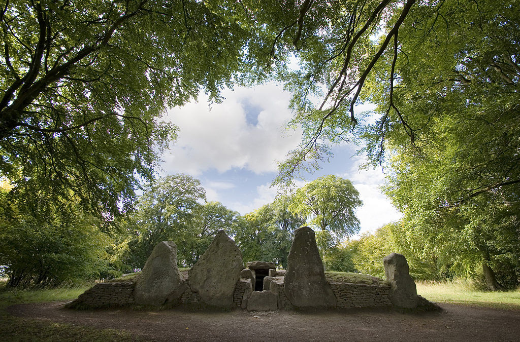 "Wayland Smithy Long barrow" by Msemmettis licensed under CC BY-SA 3.0.